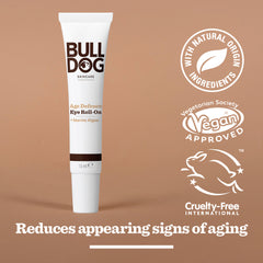 The Age Defence Eye Roll-On is displayed on a brown background, featuring icons for natural ingredients, vegan approval, and cruelty-free status, with a caption noting its role in reducing signs of aging for men.