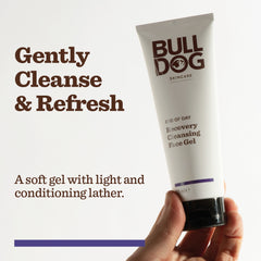 A hand holds a tube of End of Day Recovery Cleansing Face Gel against a white background. The text reads: Gently Cleanse & Refresh. A soft gel with light, conditioning lather and naturally derived cleansers.