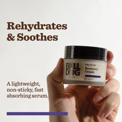 A hand holds a jar of End of Day Recovery Cream against a plain background. Text reads: Rehydrates & Soothes. A lightweight, non-sticky, fast-absorbing formula.